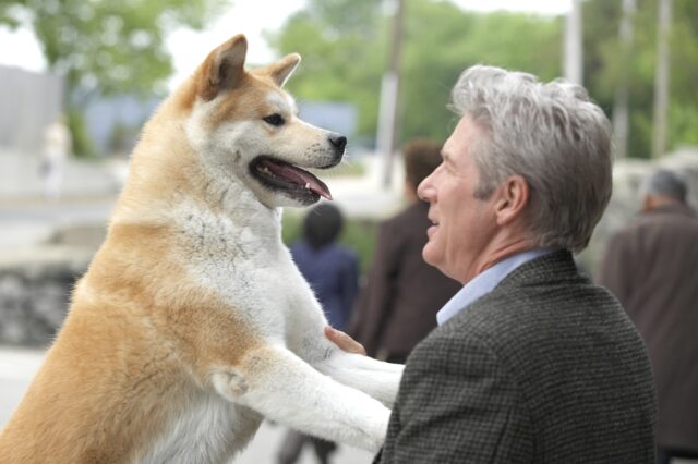 Hachi greets the Professor at train station